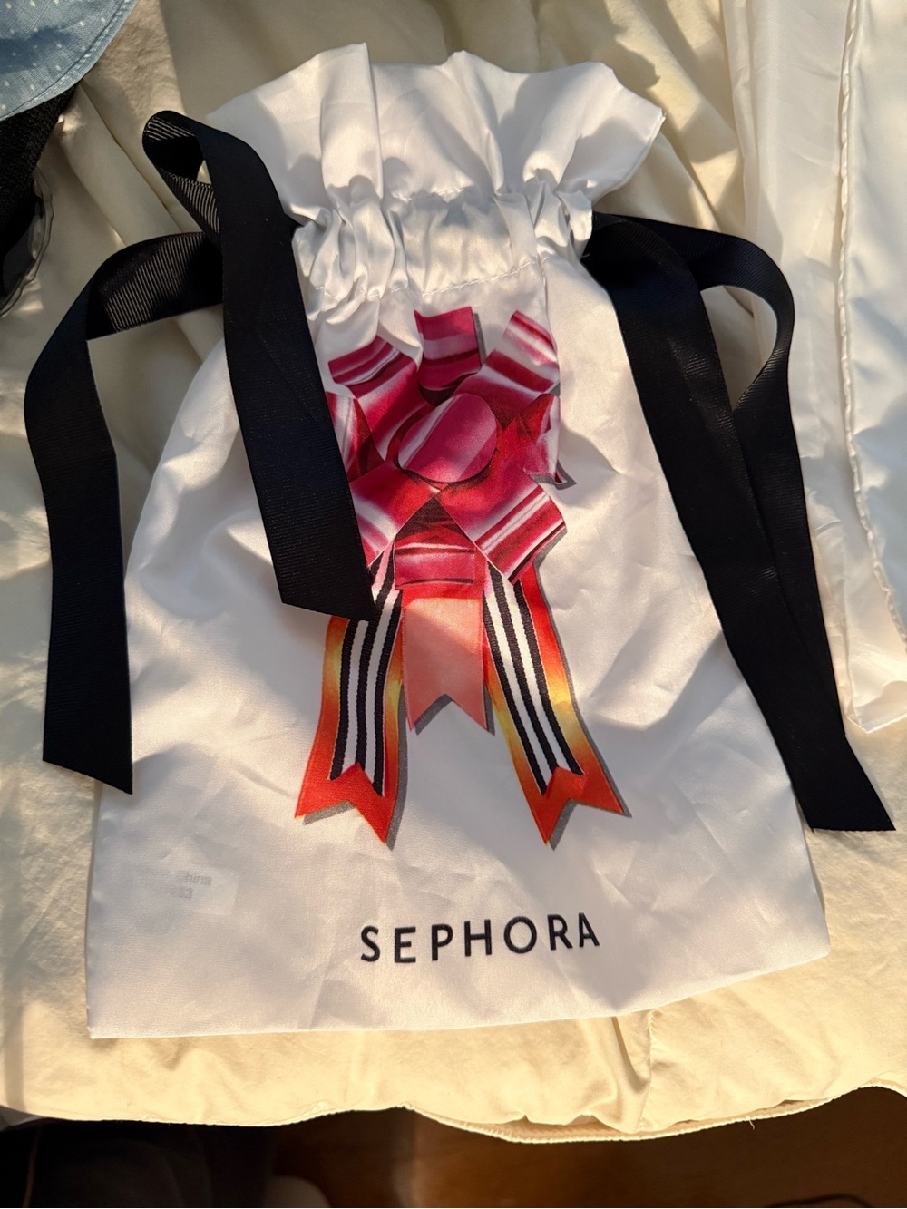 Sephora White Drawstring Bag with Pink Ribbon Graphic and Black Ties